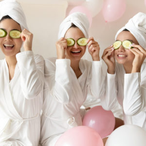 Overjoyed multiracial girls have fun making beauty procedures at party Hen party in SPA